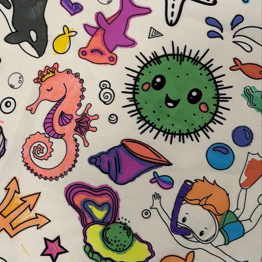 Colorful under the sea and underwater illustrations on a fabric coloring tablecloth made by Artistic Chaos Ink.