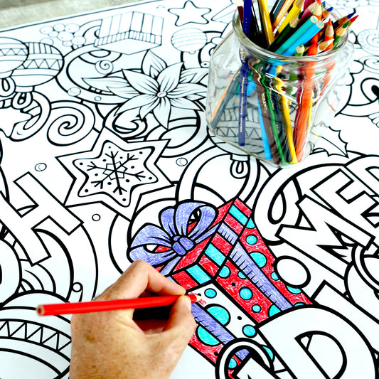 Coloring wall banner with intricate designs and a hand holding a red pencil.