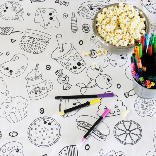 Artistic Chaos Ink Fabric Coloring Tablecloth with silly fun food images, popcorn and bright colored washable markers.