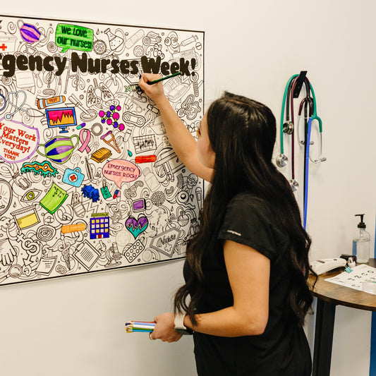Nurse coloring on a personalized nurses week poster.  A bulletin board with 'Nurses Week' decorations in a medical setting.