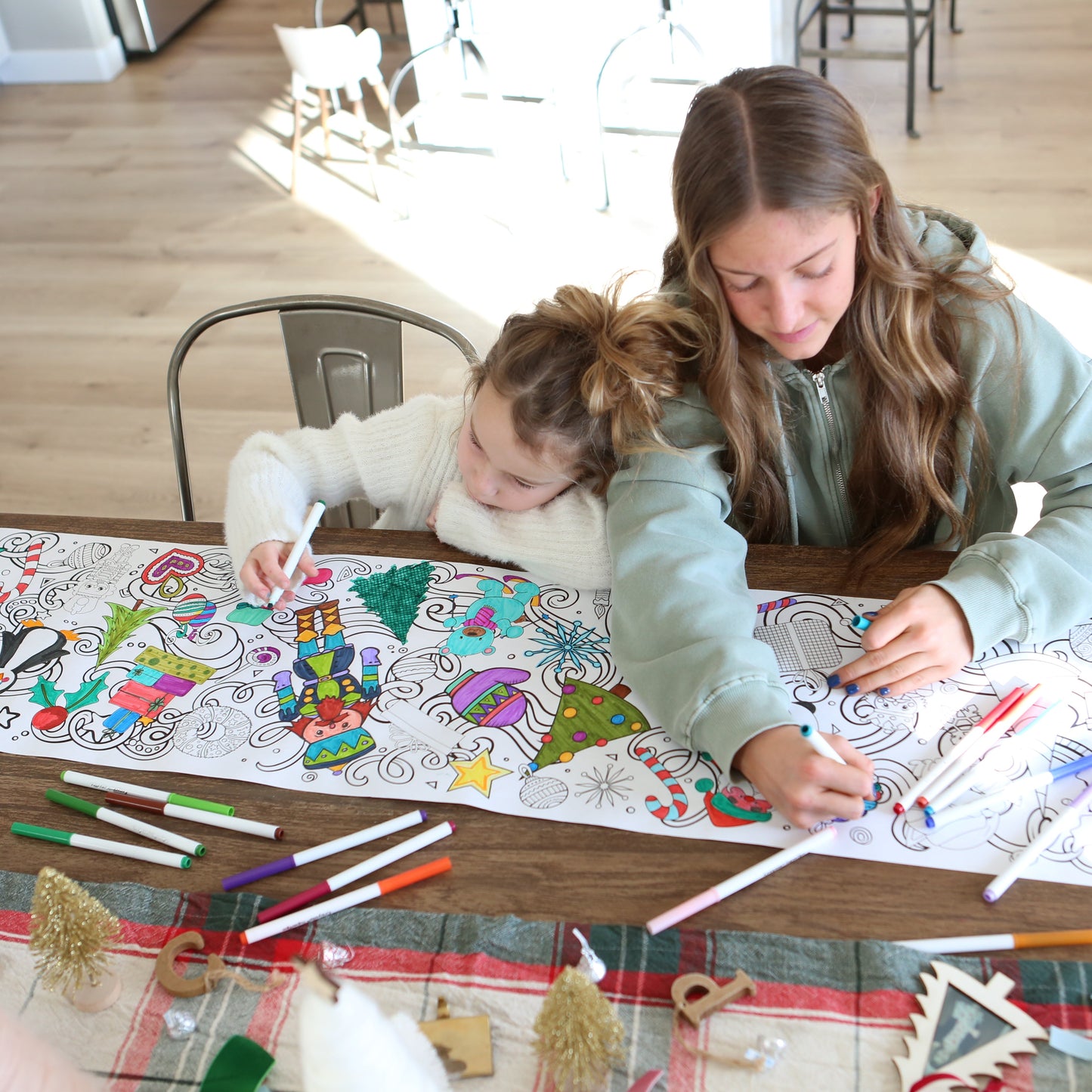 cute girls getting cozy coloring together. 