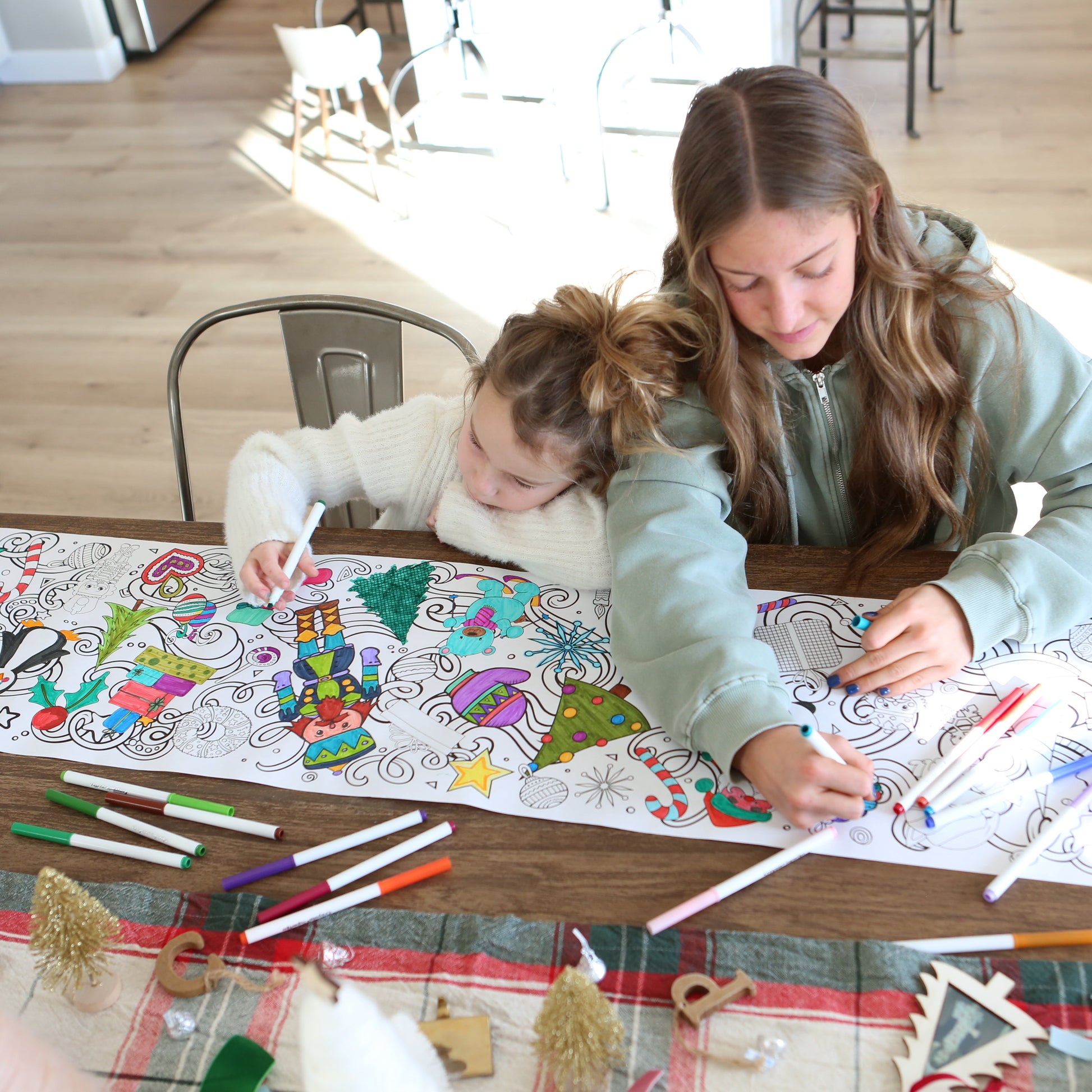 cute girls getting cozy coloring together. 