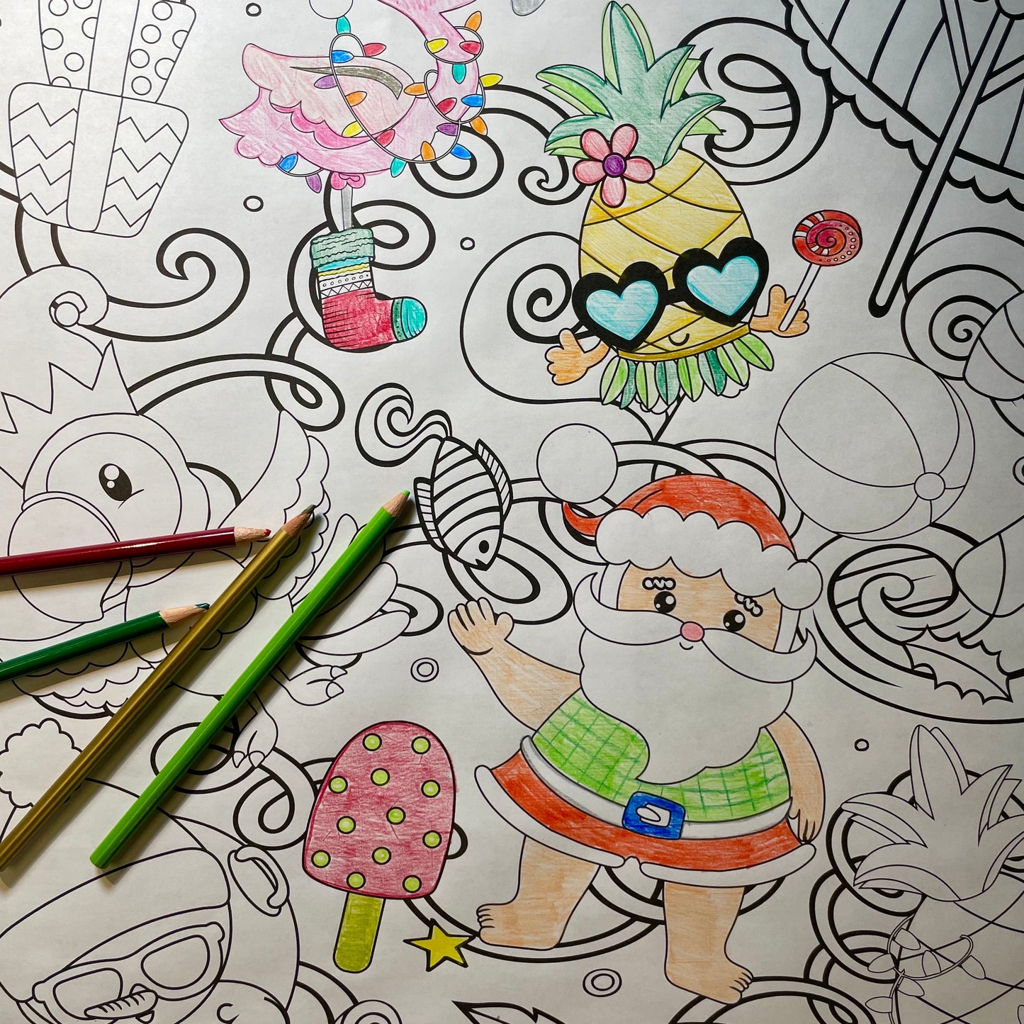 tropical  Christmas coloring banner partially colored with colored pencils which are also in the image
