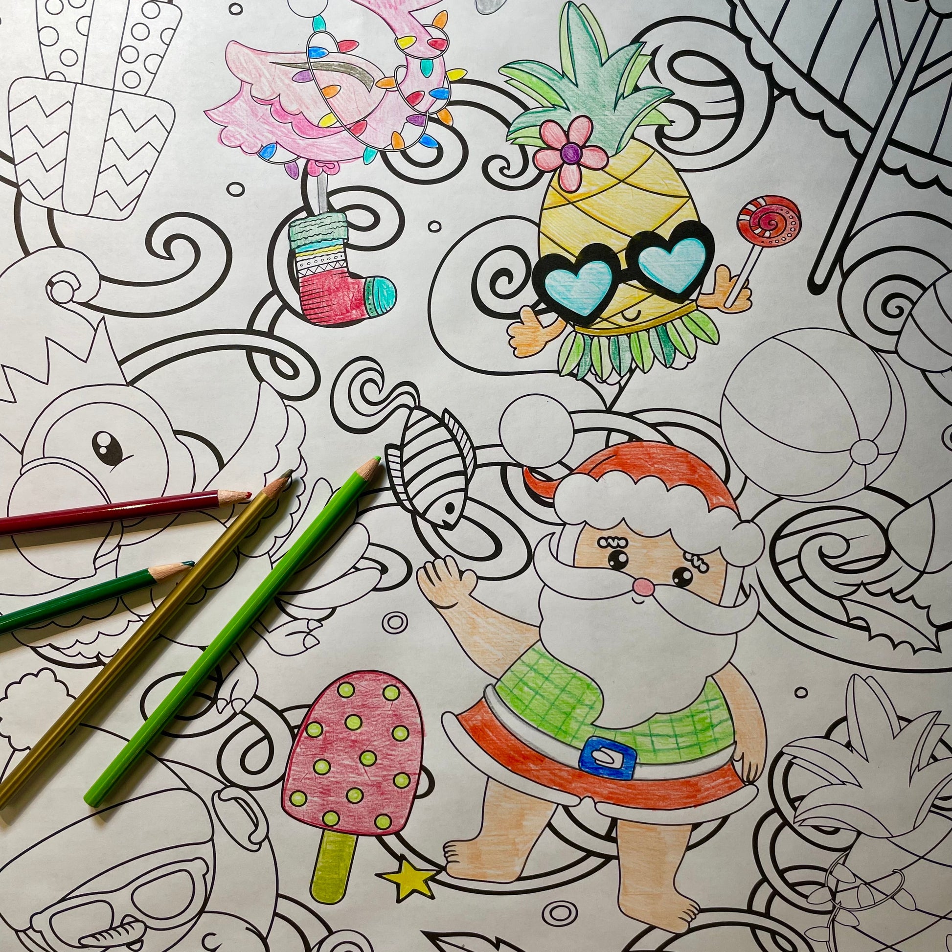 tropical  Christmas coloring banner partially colored with colored pencils which are also in the image
