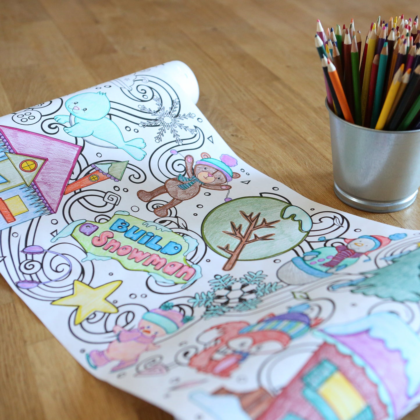 Coloring Roll with Winter themes on it. Colored with bright colored pencils and rolled to the side